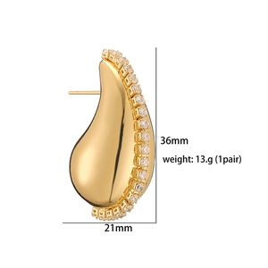 Detailed view showing 36mm by 21mm dimensions of these vintage gold C-shape earrings