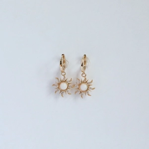 Golden sunburst star pendant earrings with opal center and micro-pave zircons