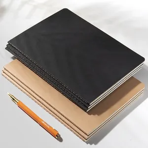 Minimalist B5 notebook set with black and kraft paper covers and an orange pen