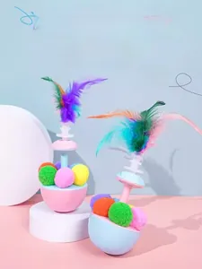 Close-up of tumbler cat toy featuring colorful feathers and vibrant plush balls detail