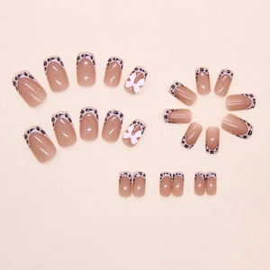 Detailed set of 24 pink leopard print press-on nails with 3D white bows and square shape