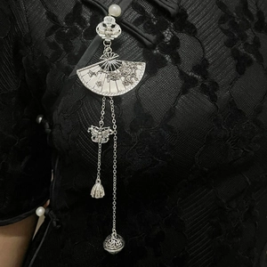Vintage Chinese fan brooch with silver floral tassels on black lace cheongsam