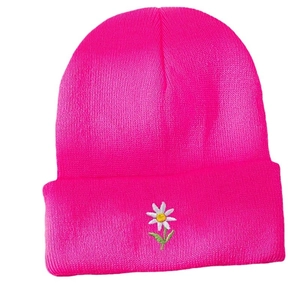 Neon pink knit beanie hat with daisy embroidery in a minimalist winter casual style