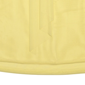 Detailed close-up of light yellow mesh fabric texture with pleated folds and hem stitching