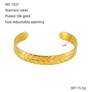 Detail of 18K gold plated stainless steel bracelet showing herringbone wheat pattern