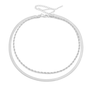 Silver layered necklace with twist chain and flat snake chain on white background