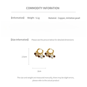 Detail view of vintage beaded earrings with copper and imitation pearl specifications