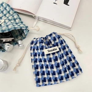 Pochette à cordon à carreaux bleus et blancs pour le voyage et les produits de beauté
