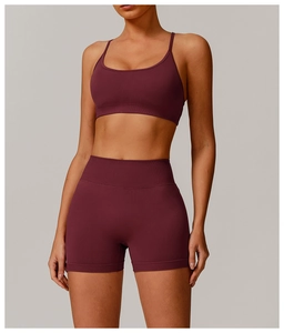 Close-up of deep wine red seamless knitted yoga set with ribbed support waistband