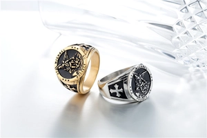 Detail of St. Michael archangel rings in gold and silver finish with cross relief