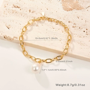 Detailed view of 925 silver gold chain bracelet with a natural freshwater pearl drop