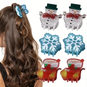 Glittery Christmas hair clips featuring snowman and snowflake designs for holiday styling
