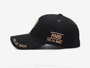 Detail of black twill cotton baseball cap featuring gold letter embroidery on the side