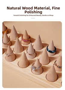 Macro view of polished solid wood cone ring display stand with multi-slot storage base