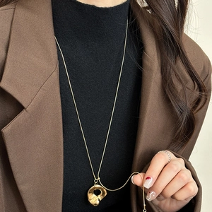 Minimalist irregular hollow ring pendant long necklace for women with retro gold finish