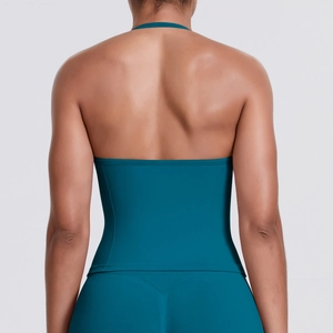 Close-up of seamless racerback design and muscle definition in blue yoga vest