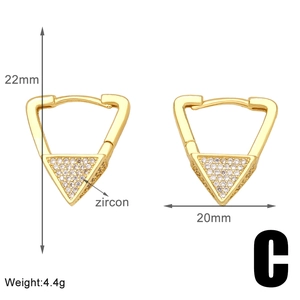 Macro detail of triangle zircon earrings in gold finish with 22mm by 20mm dimensions