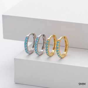 Close-up of 9mm S925 sterling silver and gold hoop earrings with inlaid turquoise stones