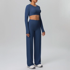 Detail view of navy blue long sleeve crop top and high waist wide leg yoga pants set