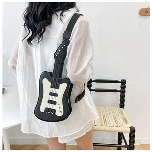 Detailed view of creative guitar-shaped crossbody bag with contrast stitching and wide strap