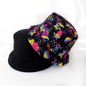 Detail view of foldable bucket hats with street style graffiti print and solid black color