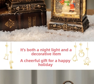 Detail of Christmas lantern snow globe with snowman and warm LED lighting display