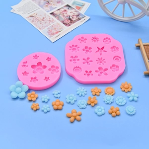 Detailed view of pink silicone flower molds for fondant cakes and DIY craft decorations