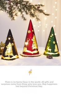 Three-piece cone Christmas LED lights with reindeer patterns on festive snow display