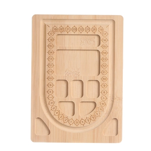 Macro detail of bamboo beading tray showing U-shaped track and storage compartments