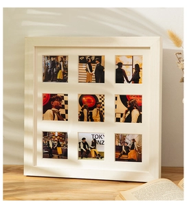 Detail of white 9-grid photo frame for wall and tabletop with romantic city travel photos