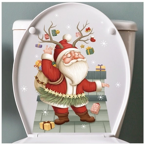 Detail of Santa Claus and reindeer decal applied on a white bathroom toilet lid
