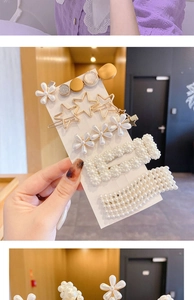 Close-up of five elegant pearl and gold alloy hair clips featuring flower and star shapes