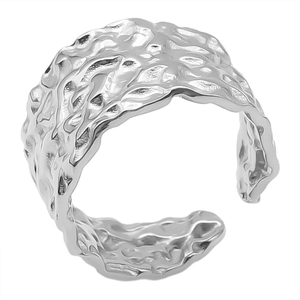 Macro detail of silver geometric adjustable ring with irregular molten metal texture