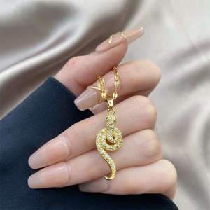 Vintage 18K gold-plated snake pendant necklace with shimmering zircon and green eyes