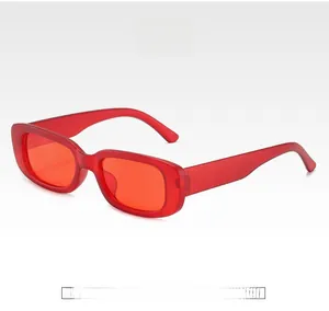 Detail shot of vintage red rectangular sunglasses with narrow translucent injection frames