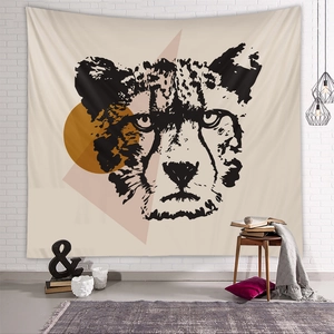 Detail view of modern cheetah art tapestry with geometric patterns on white brick wall