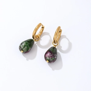 Detail of teardrop natural stone earrings with gold metal clasp and green stone texture