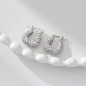 Sparkling U-shaped hoop earrings featuring micro-pave white zircon in silver finish