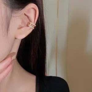 French minimalist double-layer gold ear cuff with shimmering pavé zircon stones