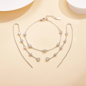 Detail of silver S925 sterling silver jewelry set with zircon tassels and long earrings