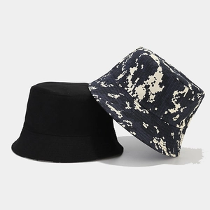 Detail showing the double-sided design with solid black and digital camouflage canvas fabric