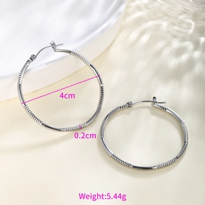 Detailed view of silver hoop earrings showing 4cm diameter and textured chain pattern