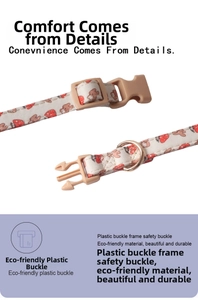 Detail of pet collar with strawberry and rabbit patterns plus durable safety buckle