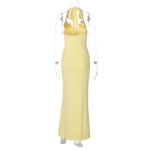 Rear view of a light yellow bodycon halter dress with lace-up back and long slim silhouette