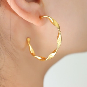 Roman style twisted gold C-shape hoop earrings in 18K gold plated stainless steel