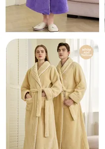 Detail of soft cream white coral fleece bathrobe with plush collar and tie belt