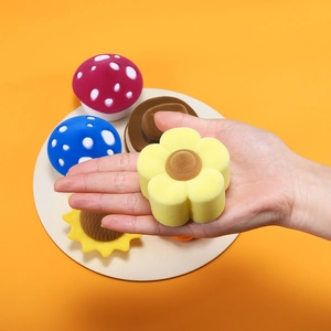 Detail of yellow flower velvet ring box held by hand for jewelry size perspective