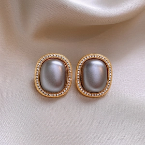 French vintage style gold earrings with grey oval pearls and pavé rhinestones on silk