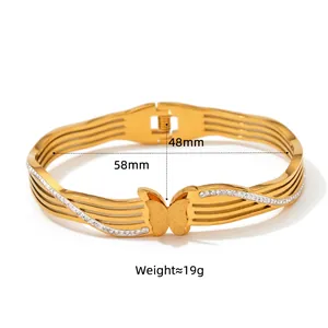 Polished gold stainless steel butterfly spring bracelet with rhinestones and matte finish