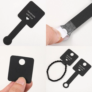 Black self-adhesive jewelry cards with Handmade with love text for rings and hair bands